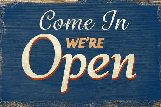 Fototapeta Distressed wood sign showing multi-font Come In We're Open text and chipped edges in flat design