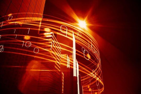 Orange light beams over skyscrapers