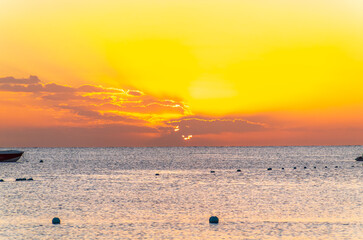 Beautiful yellow and orange sunrise over the sea.