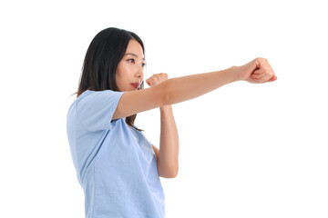 Young Asian woman practicing martial arts on white background