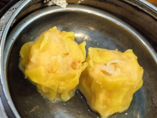 Steamed pork and shrimp dumplings (Siu Mai) in a metal dish