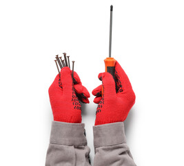 Worker's hands holding screwdriver and screw on white background