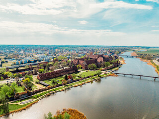 Fototapeta premium Teutonic Malbork castle in Pomerania region with Nogat river in Poland