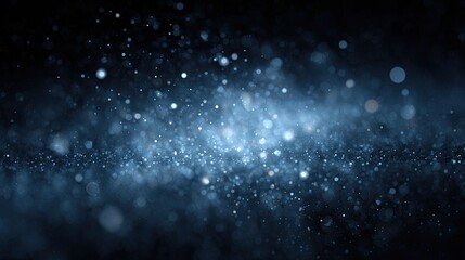 Obraz premium Ethereal Blue Glittering Particles in Dark Space Background