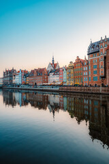 Obraz premium Gdansk with Motlawa river in Poland. Old town colourful house with Holy Spirit Gate