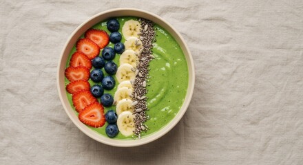 Delicious Green Smoothie Bowl with Strawberries Blueberries Banana Seeds