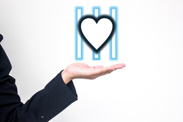 Lack of empathy presentation concept with heart symbol behind bars, symbolizing coldness or...