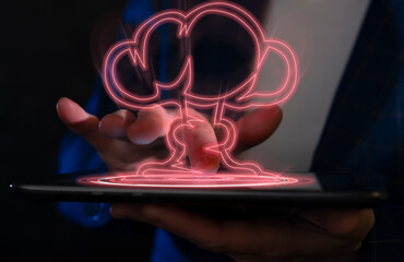 Holographic nuclear explosion on a virtual tablet. A man presses a virtual red button with his...