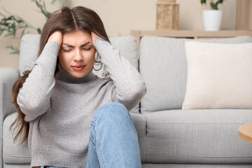 Young woman having panic attack at home
