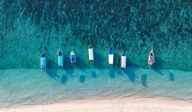 Boat along the shore in a row in Gili trawangan