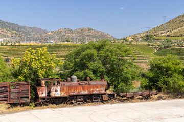 Rusty abandoned steam train in Vila Nova de Foz Coa, Portugal, showcasing decay and industrial...