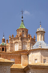 Cathedral of Teruel showing colorful tiled domes and brick walls in Aragon, Spain