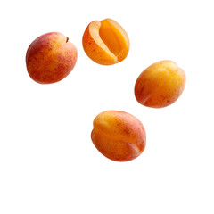 Ripe apricots falling on black background