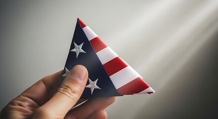 Hand Holding Folded American Flag A Symbol of Patriotism and Remembrance