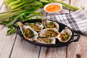 Gournet grilled oysters with onion and peanut