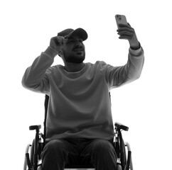 Silhouette of young man in wheelchair with mobile phone taking selfie on white background