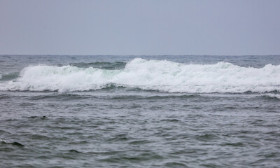 The ocean is calm and the waves are small