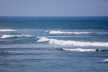 The ocean is calm and the sky is clear
