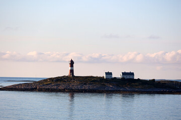 Buholmrasa lighthouse on the island of Sonnaholmen in late sunshine, Norway