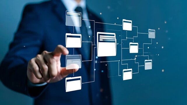 A person's finger interacts with a digital network of file folders displayed on a screen