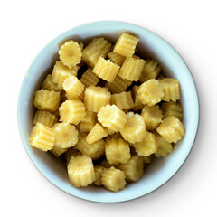 A bowl filled with small, yellow corn-shaped snacks or vegetables, showcasing their unique shape and color.