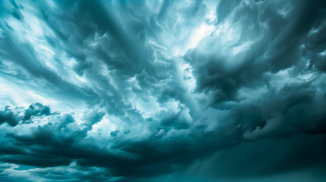 Dramatic storm clouds in deep blue, a sweeping skyscape with dynamic light, nature's raw power on display
