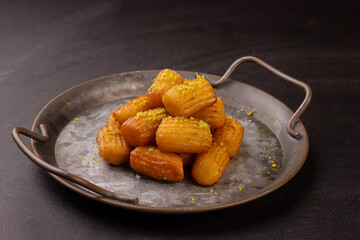Tulumba or Balah El Sham is Turkish Fried Choux Pastry Dough With Simple Syrup. 
