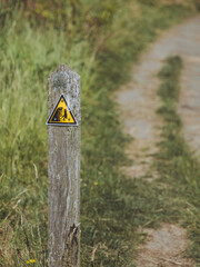 Danger from falling from clifftops warning sign on a coastal path