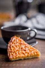 Sweet almond pie on wooden table.
