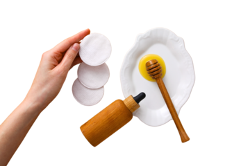 Hand with cotton pads, honey, egg, isolated on white, PNG