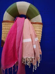 
composition of things for summer, rubber circle, shawl, blue background
