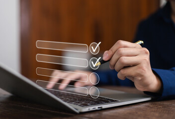 Businessman working on computer using laptop. Concept of business performance tracking and evaluation. Document management system DMS. Performance checklist evaluation form.