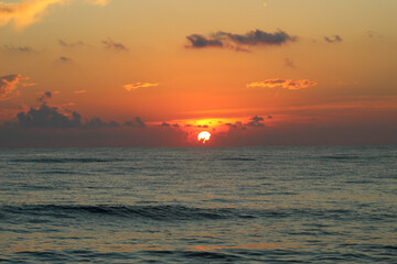 Florida cloudy orange beach sunset over the ocean