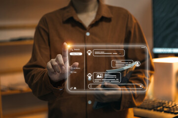 A user interacts with a chatbot on a futuristic holographic screen, demonstrating the use of AI for...