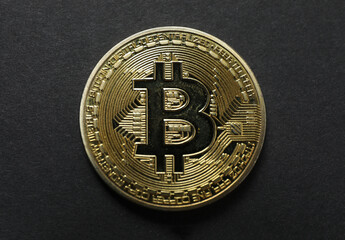 Bitcoin on a black background. gold coin cryptocurrency. Iron