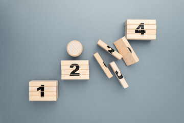 A round wooden block on the path to success includes unexpected obstacles, breaks, or irregular...