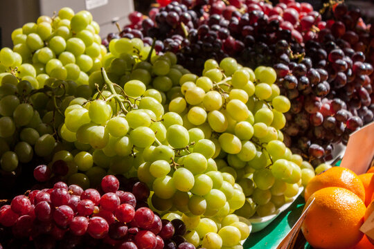 Fresh Grapes and Oranges for Sale at the Farmer's Market