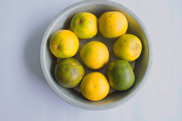 fresh lemon slice, orange slice, jeruk baby, citrus sinensis, green lemon, yellow lemon in white background