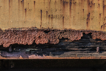 STEEL AND WOOD - Peeling paint and rust on iron