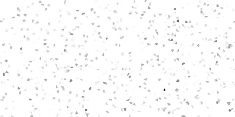 Abstract mosaic pattern background composed of varied tones of gray geometric shapes and fragments scattered across a white backdrop