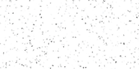 Gray tiled scattered shapes on a white surface creates a textured pattern suitable for digital designs and creative projects