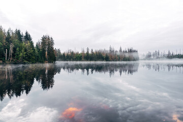 A foggy morning by a lake