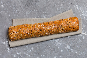 fresh crunchy french baguette on colored table. Top view Bakery products