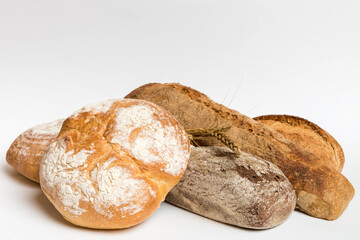 Homemade natural breads. Different kinds of fresh bread as background, perspective view with copy...