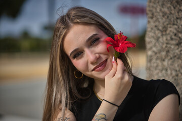 Portrait of a young, beautiful woman, blonde, with green eyes, looking at the camera while...