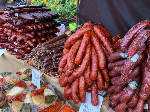 Piles of home made sausages at an outdoor market