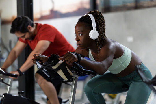 Healthy woman in a spinning class at the gym.