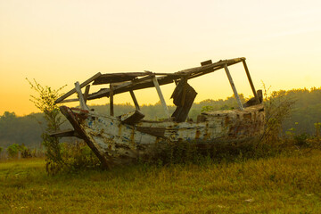Fototapeta premium the ship was stranded on the edge of the lake near the cornfield on morning