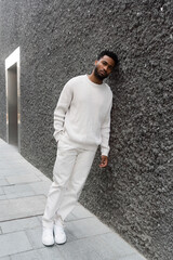 Thoughtful Man Leaning Against a Wall