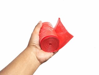 Man hand holding a roll of plastic bag isolated on white background 